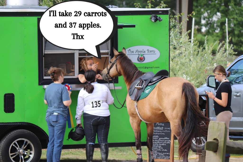 Charimsa at the food trailer ordering apples and carrots